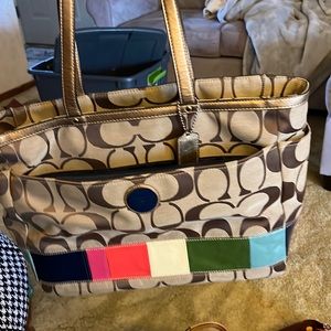 Coach diaper bag with changing pad